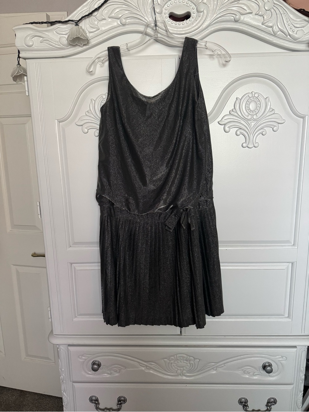 Sleek Black Sleeveless Mini Dress with Pleated Skirt